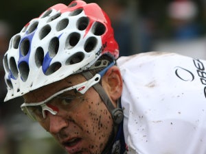 World Cup leader Julien Absalon looks over his shoulder for his competition as he heads for the finish line.