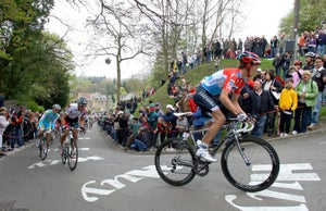 Andy Schleck leads Philippe Gilbert and Contador on the second ascent of the Mur de Huy.