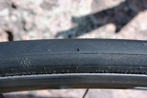 A large cut like this might flat tires with flimsy casings, but this one is still going strong.