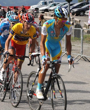 BERT-JANI Brajkovic keeps a close eye on Contador.