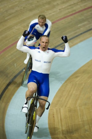 Staff celebrates the team sprint win in Beijng