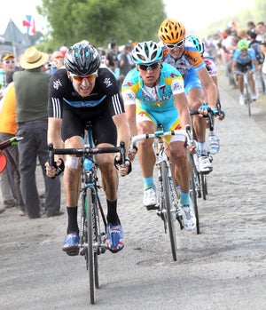 2010 Tour de France, stage 3, Bradley Wiggins and Alexander Vinokourov 2010 Tour de France, stage 3, Bradley Wiggins and Alexander Vinokourov work to minimize losses on the day's toughest cobbles.