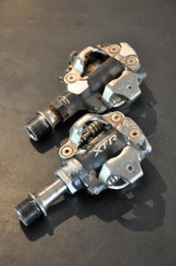 Old verses new.  Note the reduction of exposed spindle in the new 980, compared to last year's XTR pedal. Photo by Zack White