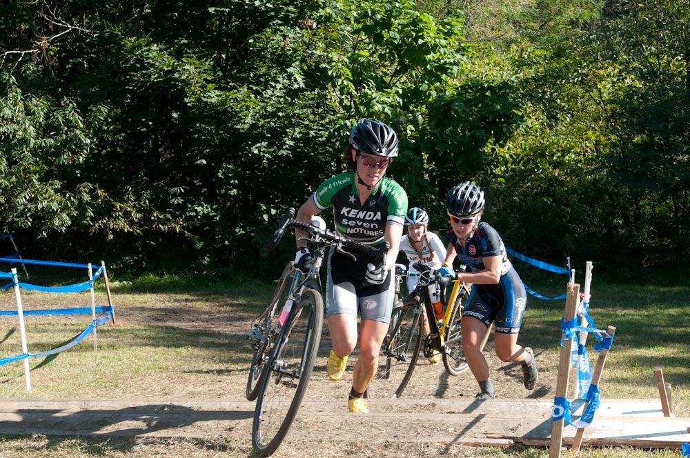 Mary McConneloug runs fast up the first set of barriers on Sunday's race.  McConneloug remained driven throughout the course and didn't show any deficiencies in the high heat. Photo: Matt Gendron