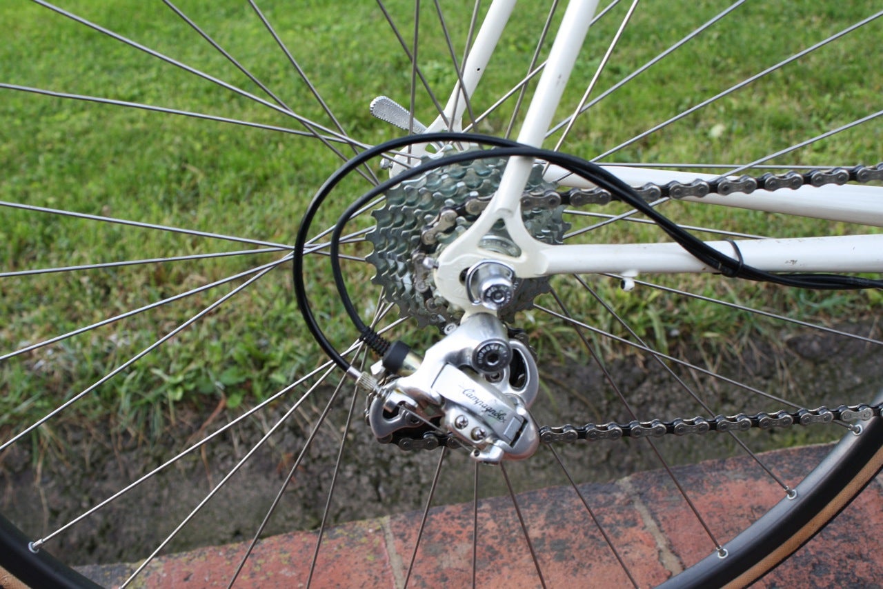 The eight-speed Campy electric rear derailleur had both an electrical wire connected to a servo motor, and a shift cable.