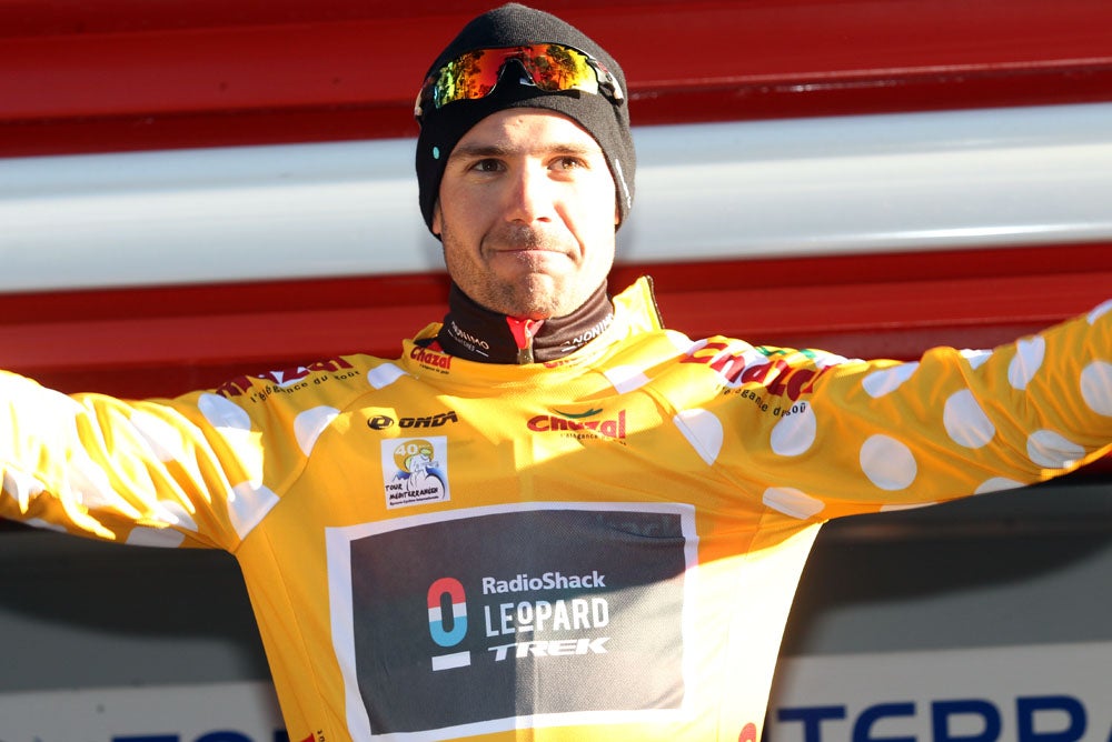 Maxime Monfort celebrates his capture of the leader's yellow jersey with just one stage remaining. 