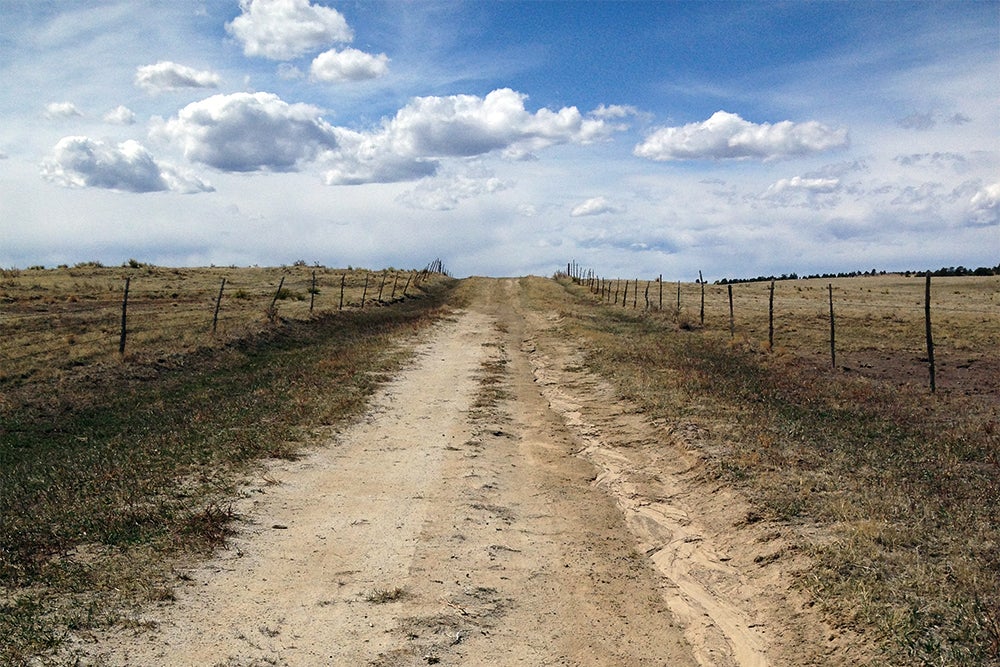 The loneliest stretch of road along an incredibly isolated AntiEpic course — the author spotted 20 cars all day — was this farm track, somewhere smack dab in the middle of nowhere. | Photo: Chris Case
