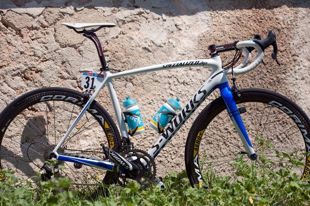 Vincenzo Nibali, nicknamed the "Shark of Messina" after his island birthplace, gets one of only a few unique paint jobs from Specialized at this year's Giro — but not a pink one. Astana's PR man Chris Baldwin says he won't jinx the pink jersey, and will only pull a special bike out for the final day, should he still be in the maglia rosa there. <br><br>The shark theme and more nautical color scheme extends from a small badge on the top tube to a subtle logo on fork to the choice of color for the bottom of the down tube. <br><br>Nibali is 5'11" and rides a 56cm SL4, with a saddle height of 76cm and a reach from saddle tip to bars of 60cm. As with all the Astana machines, his bike is decked out in Campagnolo and FSA components and Corima wheels. Photo: Caley Fretz | VeloNews.com