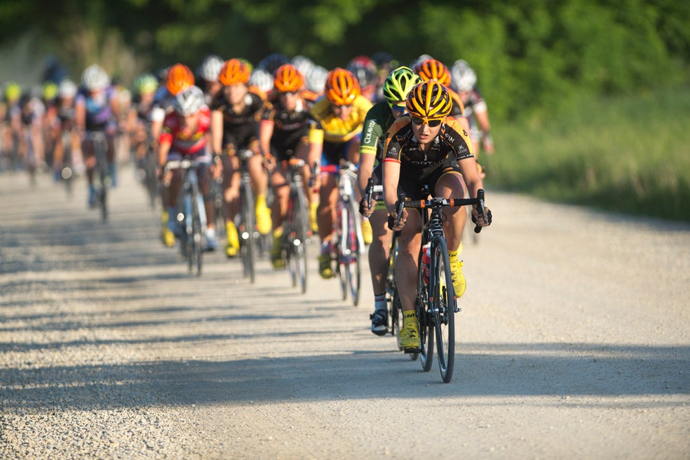 Leah Kirchmann led Optum over the stretch of dirt road at the Nature Valley Grand Prix as they closed in on the break. Photo: Casey B. Gibson | <a href="http://www.cbgphoto.com">www.cbgphoto.com</a>