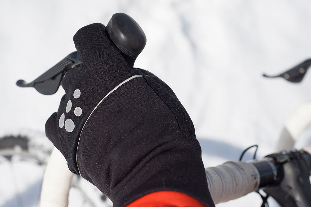 Craft's Hybrid Weather gloves masquerade as a generic mid-weight winter glove, but they have a secret. Underneath a panel on the back of the hand lives a thin, wind- and water-resistant mitten shell. It's hardly visible when tucked away, but adds a heap of versatility to the gloves. Photo: Caley Fretz | VeloNews.com