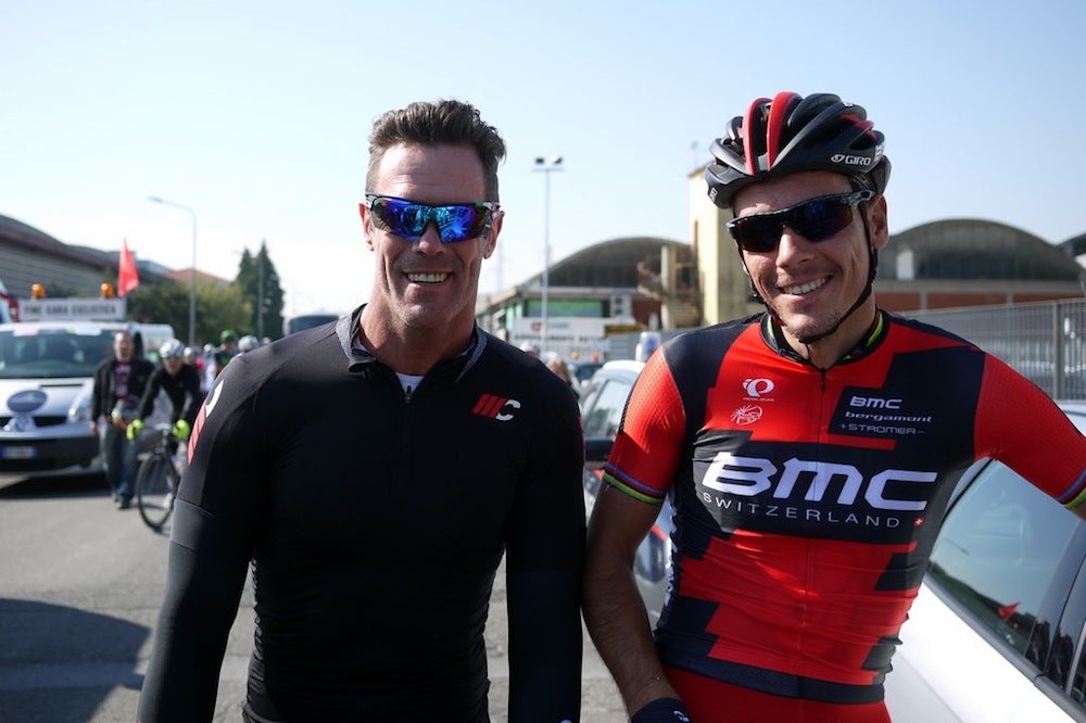 BMC's Philippe Gilbert spoke at the start of Friday's stage in Cascina with 2002 Milano-Sanremo winner Mario Cipollini. Photo by Gregor Brown.