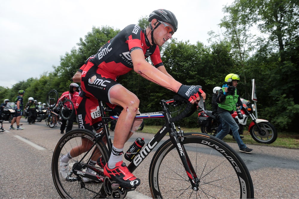Peter Velits gives Tejay van Garderen his bike after a crash in stage 7 that left the BMC team leader bloodied and about a minute behind the peloton. Photo: Tim De Waele | <a href="http://tdwsport.com" target="_blank">TDWsport.com</a>