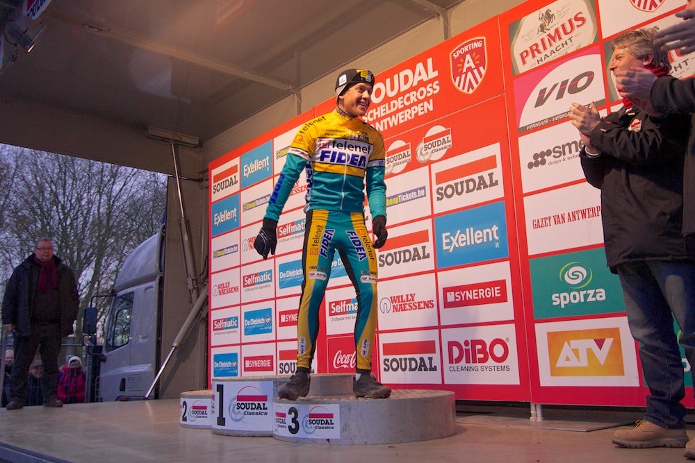 Tom Meeusen shared a laugh with officials after climbing on the podium. Meeusen had to step down and check the numbers on the front of the podium after first stepping onto the wrong platform. Photo: Dan Seaton | VeloNews.com
