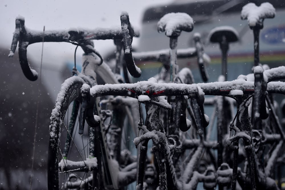 Snow blanketed bikes, cars, and riders at the end of the fifth stage at Tirreno-Adriatico. Photo: Tim De Waele | <a href="http://www.tdwsport.com" target="_blank">TDWsport.com</a>