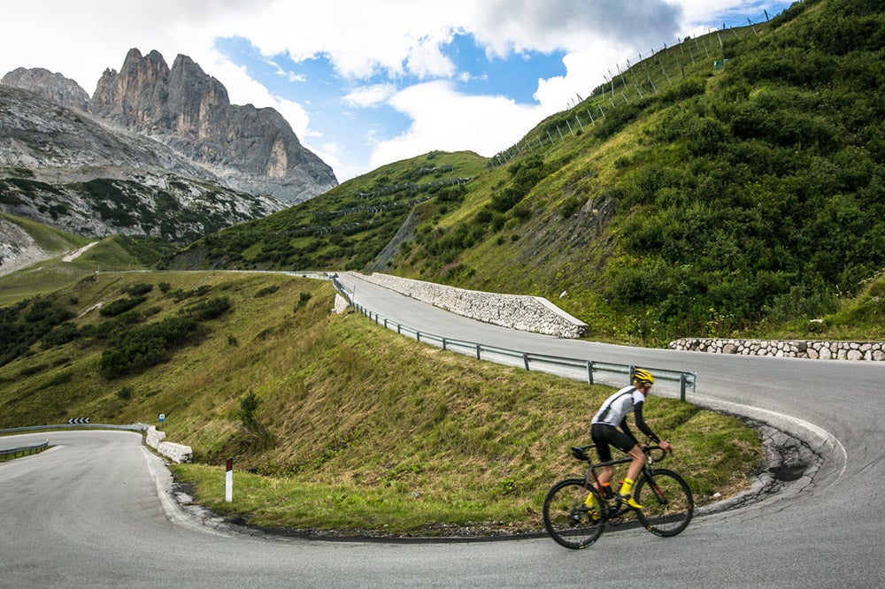 The Col Collective climbs Passo Fedaia in the Italian Dolomites.