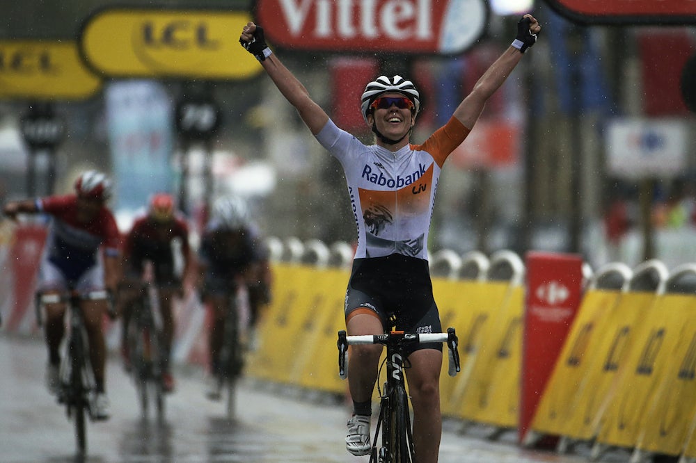 Anna van der Breggen celebrates at the line after a rain-soaked La Course. Photo: AFP