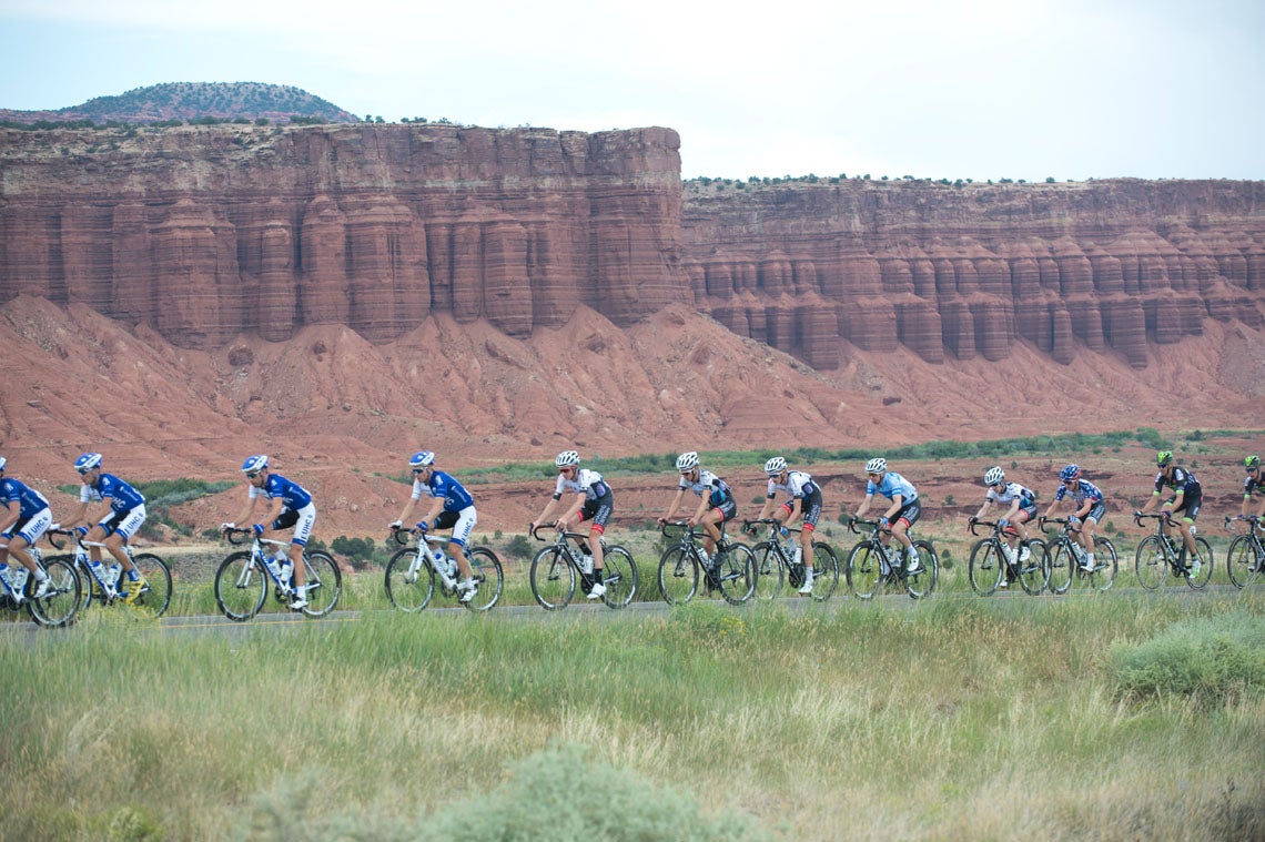 The peloton was framed by the red sandstone cliffs outside the finish town of Torrey on stage 2. Photo: Casey B. Gibson | <a href="http://www.cbgphoto.com">www.cbgphoto.com</a>