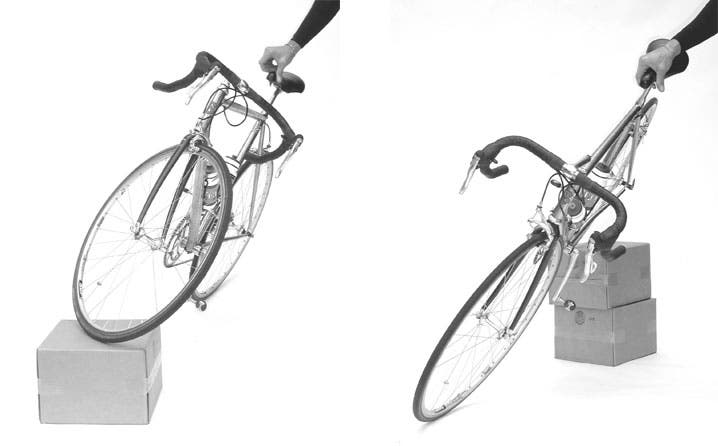 Two demonstrations of how head angle impacts trail: The first simulates a very shallow head angle and consequent large fork trail, which imparts great stability but more wheel flop; the second simulates a very steep head angle that results in negative trail and very low stability — when the bike is leaned, the front wheel turns away from the direction of lean (L-R). Photo courtesy of VeloPress