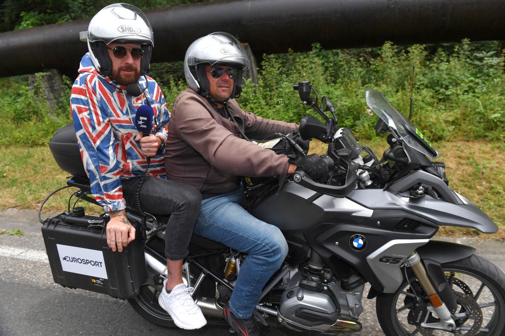 photojournalists on a motorbike