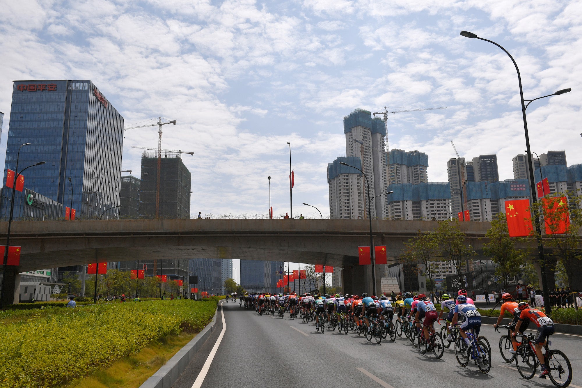 NANNING, CHINA - OCTOBER 19: Andrea Garosio of Italy and Team Bahrain - Merida / Jonas Koch of Germany and CCC Team / Bryan Nauleau of France and Team Total Direct Energie / Pieter Vanspeybrouck of Belgium and Team Wanty _ Groupe Gobert / Jenthe Biermans of Belgium and Team Katusha Alpecin / Jan Hirt of Czech Republic and Astana Pro Team / Matteo Badilatti of Switzerland and Team Israel Cycling Academy / Stefan De Bod of South Africa and Team Dimension Data / Peloton / City / Landscape / during the 3rd Tour of Guangxi 2019, Stage 3 a 143km stage from Nanning to Nanning 83m / @TourofGuangxi / on October 19, 2019 in Nanning, China. (Photo by Tim de Waele/Getty Images)