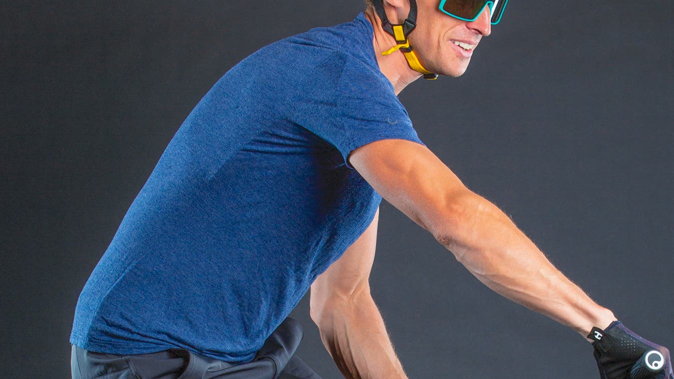 Detail of man on mountain bike wearing a t-shirt