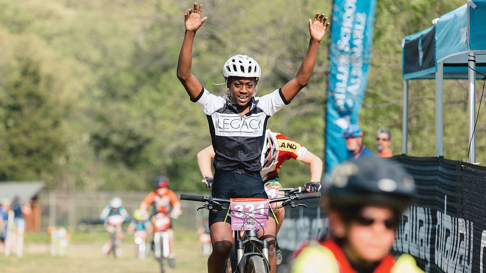 Richmond Cycling Corps' Korey Robinsonn celebrates at the finish line.