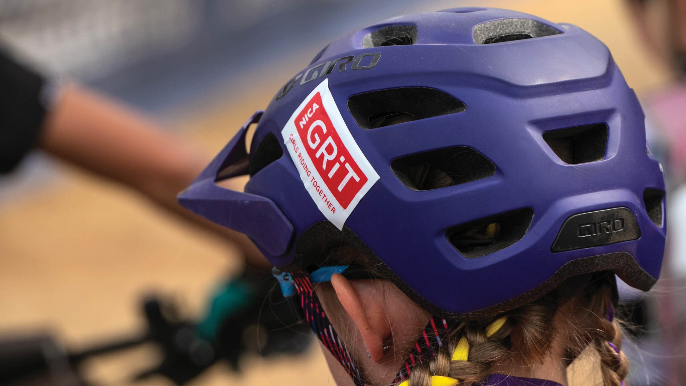 Girl's purple helmet with a NICA GRiT sticker