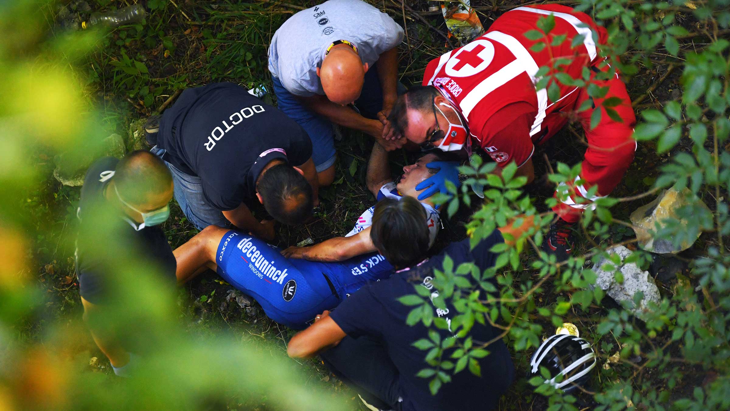 Evenepoel crashed into a wall on a bridge and hurtled down into a ravine.