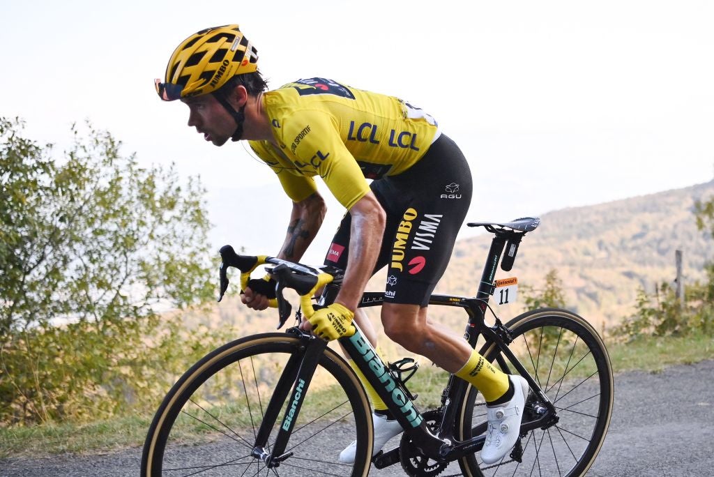 Team Jumbo rider Slovenia's Primoz Roglic wearing the overall leader's yellow jersey climbs the Grand Colombier pass during the 15th stage of the 107th edition of the Tour de France cycling race, 175 km between Lyon and Grand Colombier, on September 13, 2020. (Photo by Marco BERTORELLO / AFP) (Photo by MARCO BERTORELLO/AFP via Getty Images)
