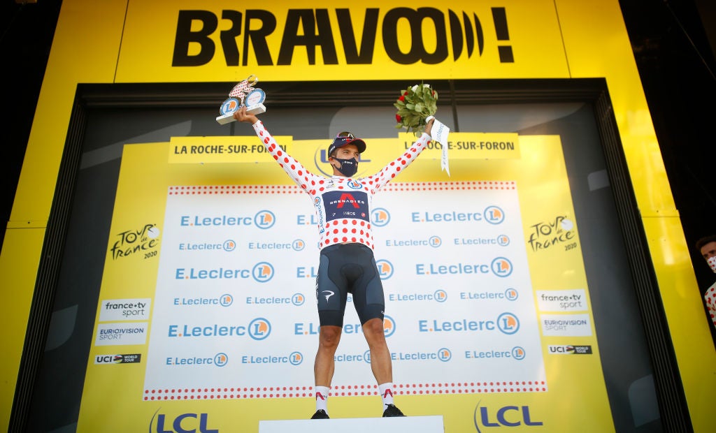 LA ROCHE-SUR-FORON, FRANCE - SEPTEMBER 17: Podium / Richard Carapaz of Ecuador and Team INEOS Grenadiers Polka Dot Mountain Jersey / Celebration / Flowers / during the 107th Tour de France 2020, Stage 18 a 175km stage from Méribel to La Roche sur Foron 543m / #TDF2020 / @LeTour / on September 17, 2020 in La Roche-sur-Foron, France. (Photo by Stephane Mahe - Pool/Getty Images)