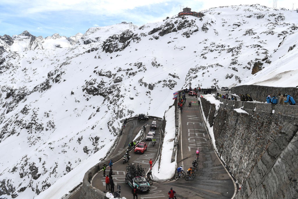 LAGHI DI CANCANO, ITALY - OCTOBER 22: Joao Almeida of Portugal and Team Deceuninck - Quick-Step Pink Leader Jersey / Rafal Majka of Poland and Team Bora - Hansgrohe / Hermann Pernsteiner of Austria and Team Bahrain - Mclaren / Fausto Masnada of Italy and Team Deceuninck - Quick-Step / Passo dello Stelvio - Stilfserjoch (2758m)/ Grenadiers Car / Team INEOS Grenadiers / Snow / Fans / Public / Peloton / during the 103rd Giro d'Italia 2020, Stage 18 a 207km stage from Pinzolo to Laghi di Cancano - Parco Nazionale dello Stelvio 1945m / @girodiitalia / #Giro / on October 22, 2020 in Laghi di Cancano, Italy. (Photo by Tim de Waele/Getty Images)