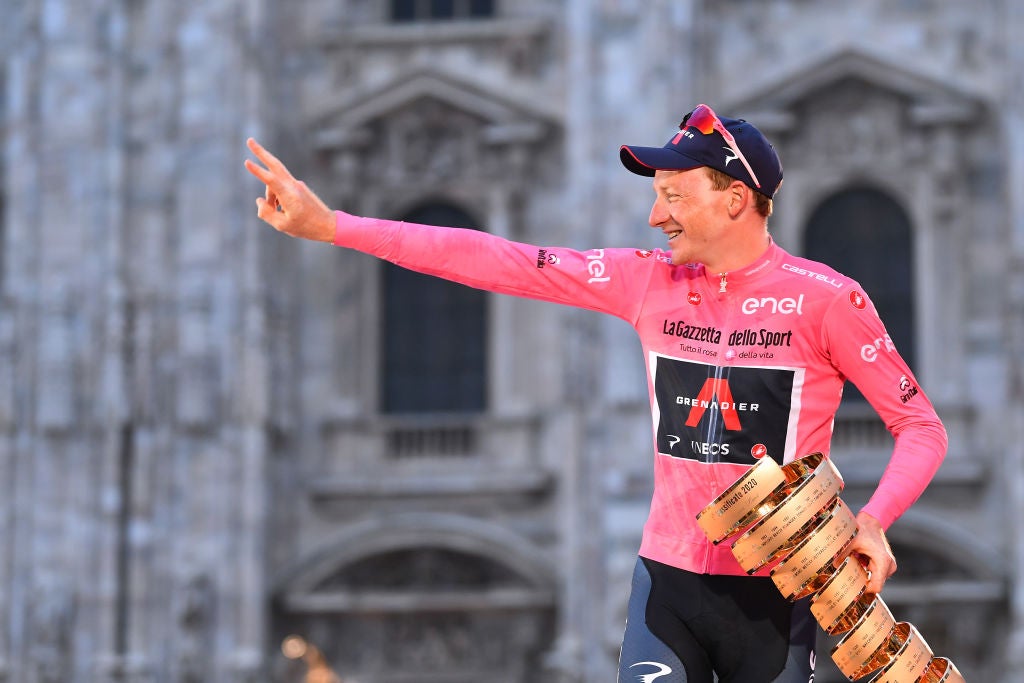 MILANO, ITALY - OCTOBER 25: Podium / Tao Geoghegan Hart of The United Kingdom and Team INEOS Grenadiers Pink Leader Jersey / Celebration / Trophy / Duomo di Milano / Milan Cathedral / during the 103rd Giro d'Italia 2020, Stage 21 a 15,7km Individual time trial from Cernusco sul Naviglio to Milano / ITT / @girodiitalia / #Giro / on October 25, 2020 in Milano, Italy. (Photo by Stuart Franklin/Getty Images,)