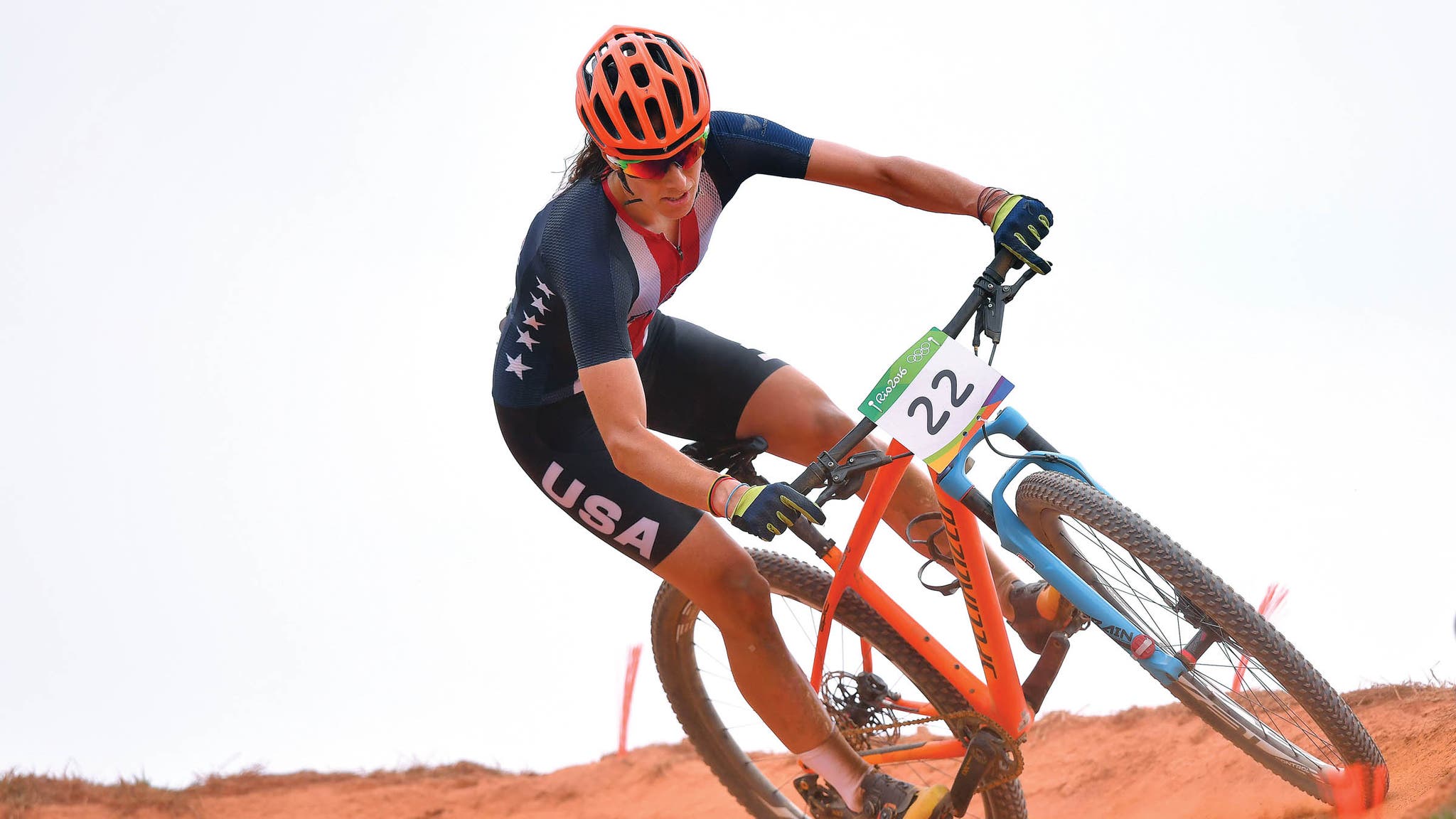 Lea Davison rounds a dirt corner on her mountain bike