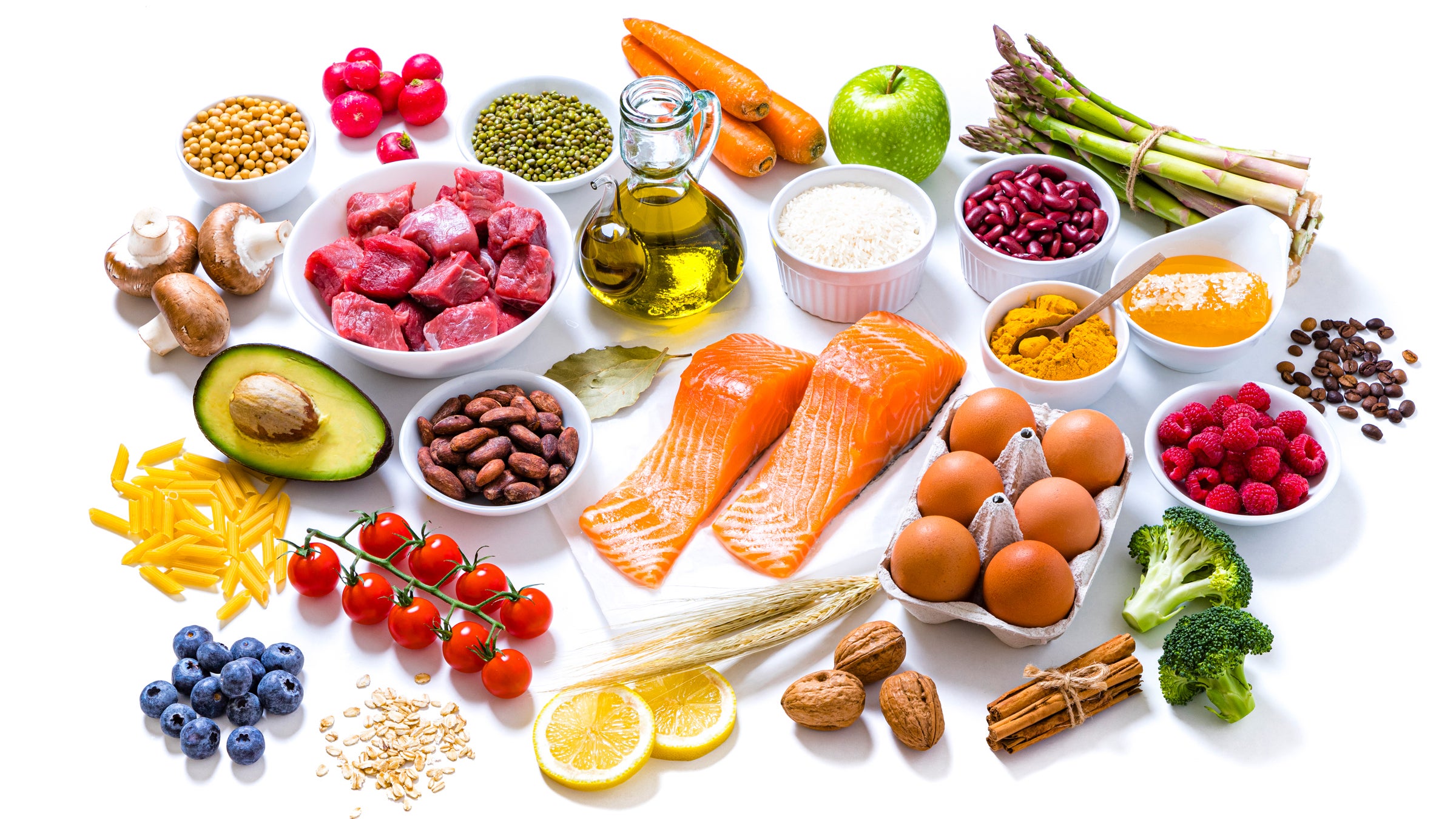 A wide assortment of colorful, healthy, fruits, vegetables, salmon, healthy fats and healthy oils