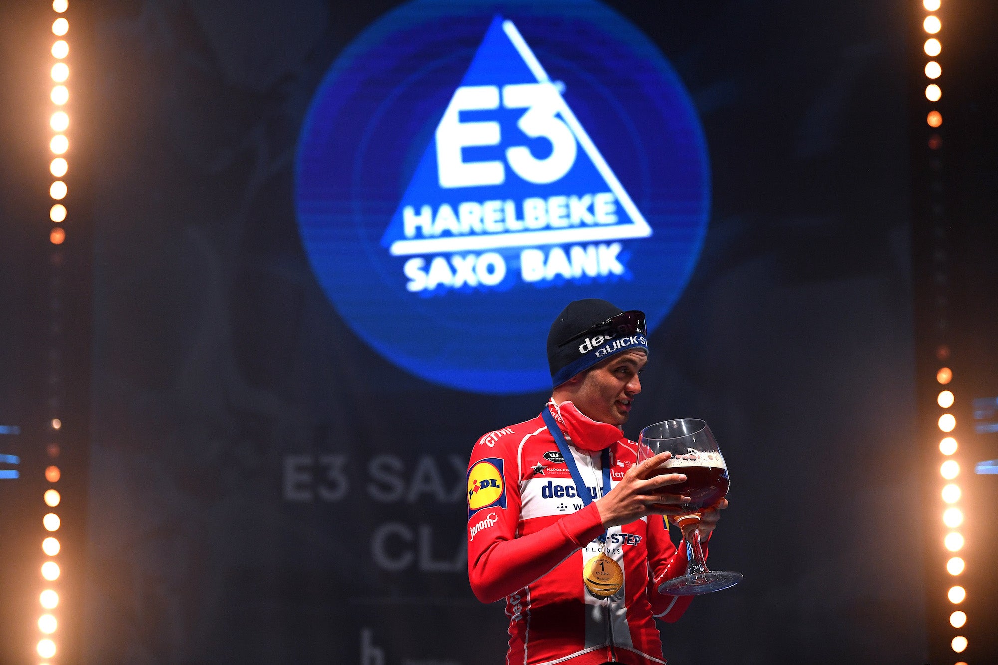 HARELBEKE, BELGIUM - MARCH 26: Podium / Kasper Asgreen of Denmark and Team Deceuninck - Quick-Step Celebration, during the 64th E3 Saxo Bank Classic 2021 a 203,9km race from Harelbeke to Harelbeke / Mask / Covid safety measures / Medal / #E3SaxobankClassic / on March 26, 2021 in Harelbeke, Belgium. (Photo by Tim de Waele/Getty Images)