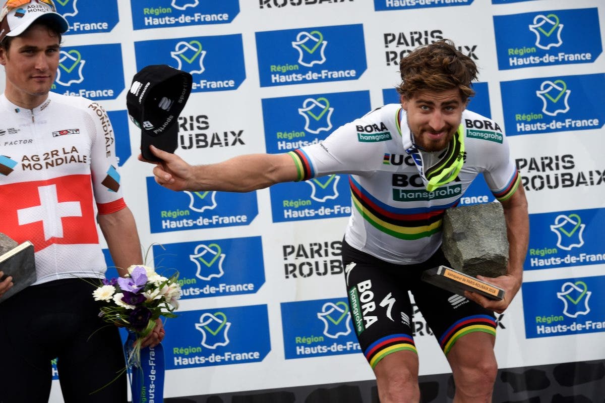 Slovakia's Peter Sagan (R) celebrates winning on the podium next to Switzerland's Silvan Dillier after the 116th edition of the Paris-Roubaix one-day classic cycling race, between Compiegne and Roubaix, on April 8, 2018 in Compiegne, northern France. / AFP PHOTO / FRANCOIS LO PRESTI (Photo credit should read FRANCOIS LO PRESTI/AFP via Getty Images)