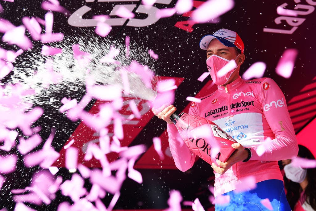 ASCOLI PICENO - SAN GIACOMO, ITALY - MAY 13: Attila Valter of Hungary and Team Groupama - FDJ Pink Leader Jersey celebrates at podium during the 104th Giro d'Italia 2021, Stage 6 a 160km stage from Grotte di Frasassi to Ascoli Piceno - San Giacomo 1090m / Mask / Covid safety measures / Champagne / @girodiitalia / #Giro / #UCIworldtour / on May 13, 2021 in Ascoli Piceno - San Giacomo, Italy. (Photo by Stuart Franklin/Getty Images)