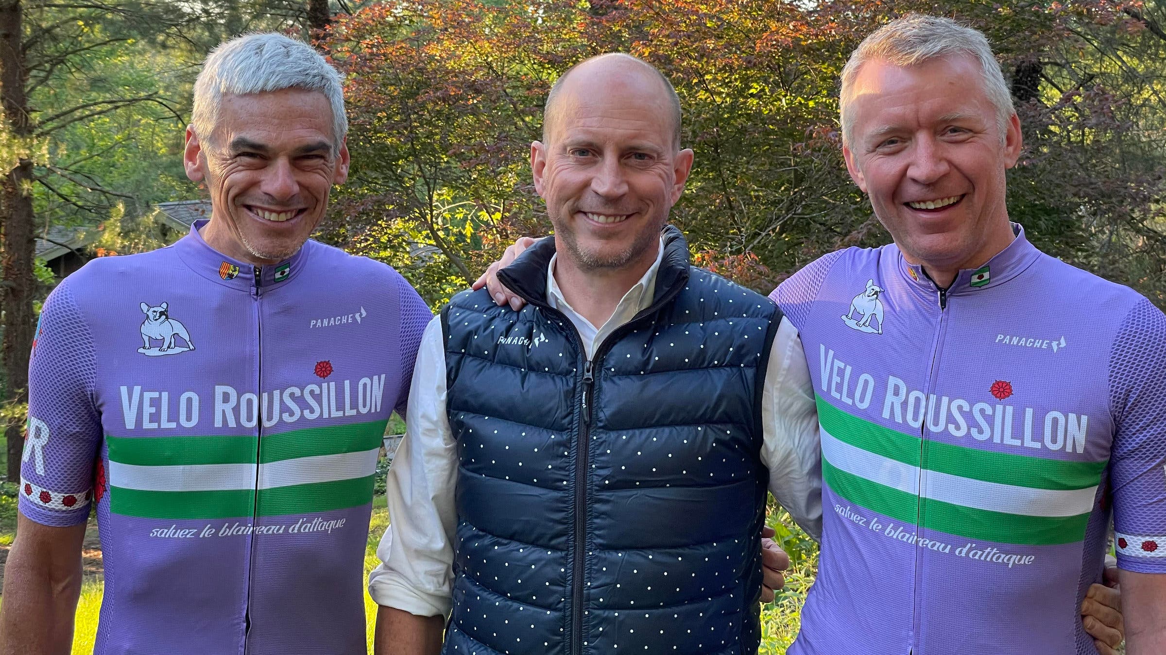 Lavender Velo Roussillon jersey presentation by Stephen Collins (center).