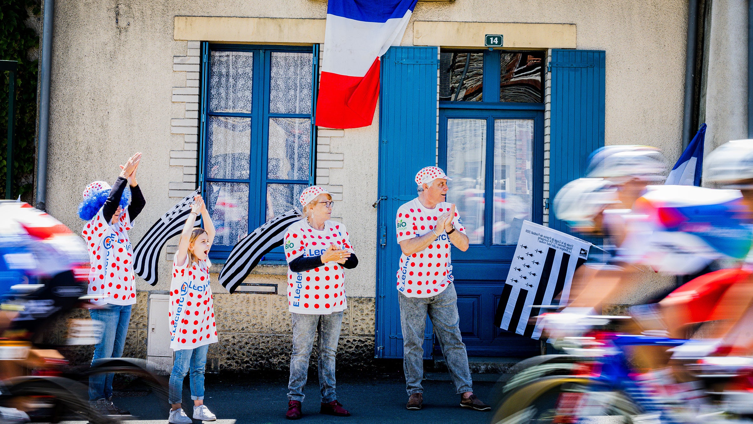 Fans wearing polka dots at stage 4 of the 2021 Tour de France.