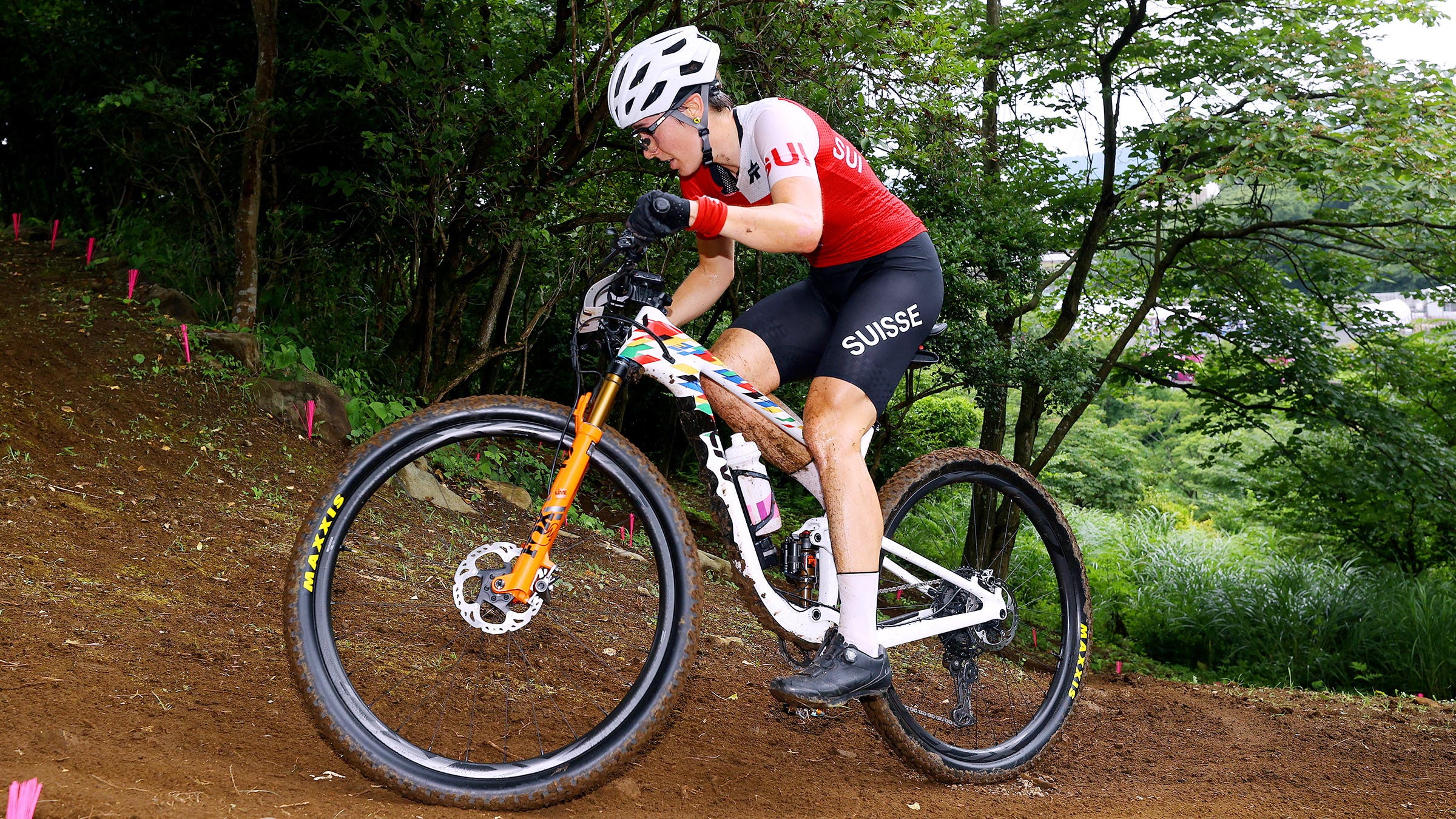 Linda Indergand racing to a bronze medal at the Tokyo Olympic Games cross-country mountain bike race.