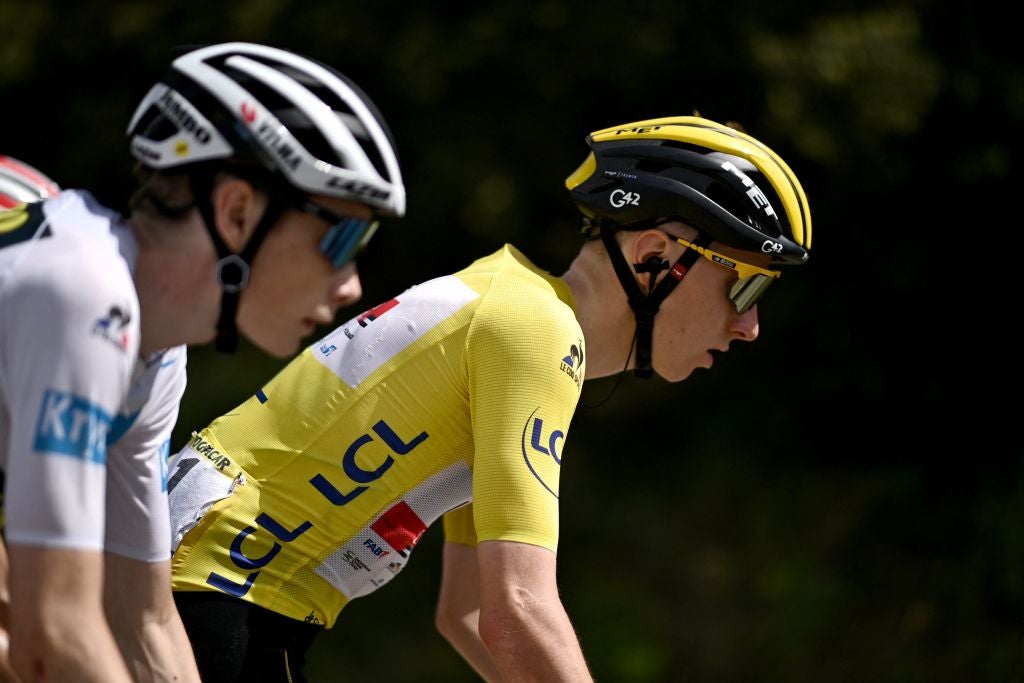 Team Jumbo Visma's Jonas Vingegaard of Denmark wearing the best young's white jersey (L) rides next to Team UAE Emirates' Tadej Pogacar of Slovenia wearing the overall leader's yellow jersey during the 12th stage of the 108th edition of the Tour de France cycling race, 159 km between Saint-Paul-Trois-Chateaux and Nimes, on July 08, 2021. (Photo by Anne-Christine POUJOULAT / AFP) (Photo by ANNE-CHRISTINE POUJOULAT/AFP via Getty Images)