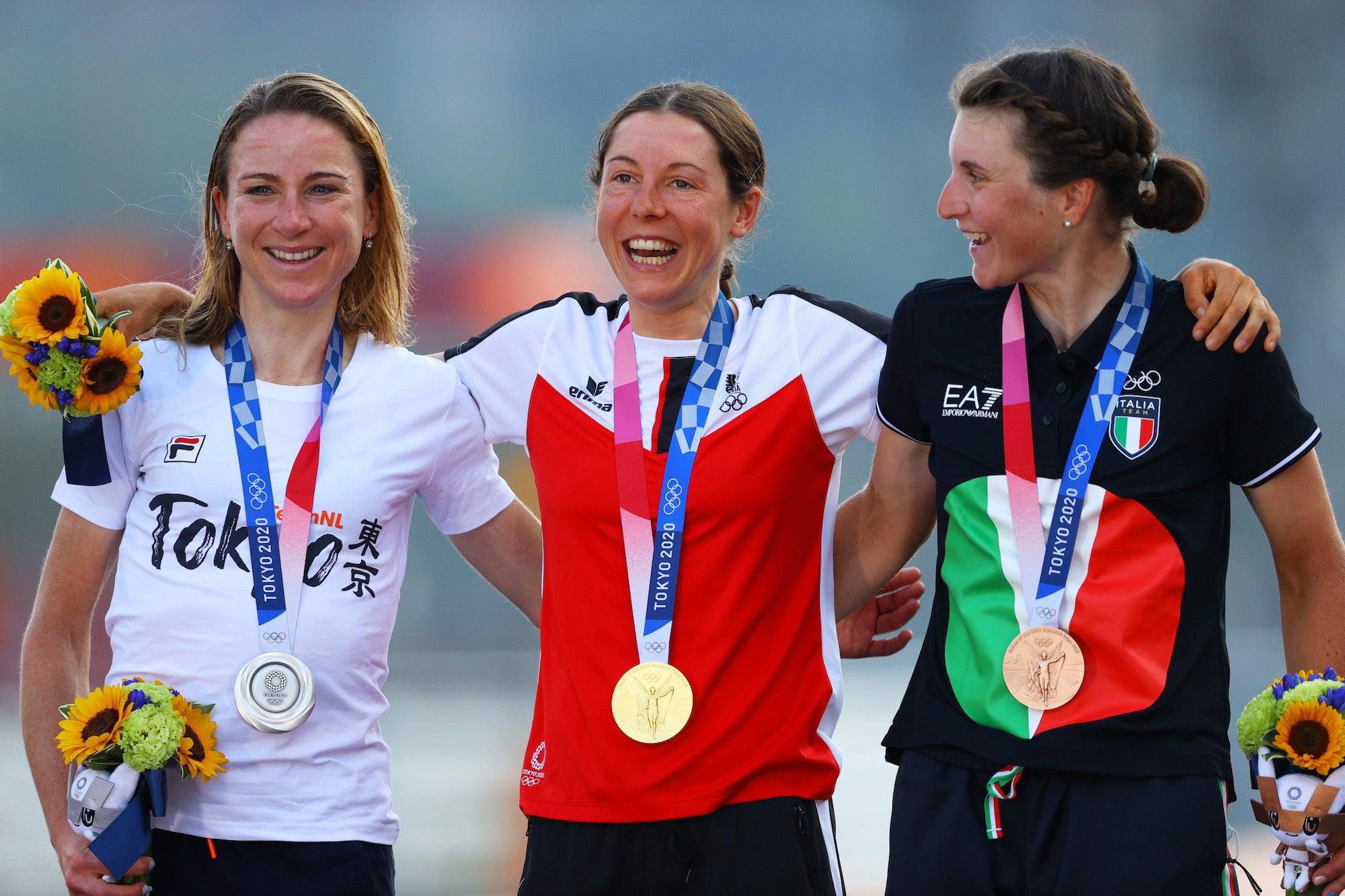OYAMA, JAPAN - JULY 25: (L-R) Silver medalist Annemiek van Vleuten of Team Netherlands, gold medalist Anna Kiesenhofer of Team Austria, and bronze medalist Elisa Longo Borghini of Team Italy, pose on the podium during the medal ceremony during the Women's road race on day two of the Tokyo 2020 Olympic Games at Fuji International Speedway on July 25, 2021 in Oyama, Shizuoka, Japan. (Photo by Tim de Waele/Getty Images)