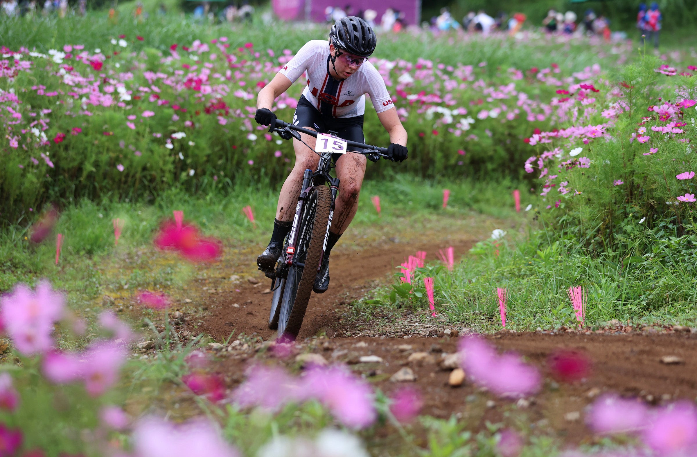 IZU, JAPAN - JULY 27: Haley Batten of Team United States rides through flowery landscape during the Women's Cross-country race on day four of the Tokyo 2020 Olympic Games at Izu Mountain Bike Course on July 27, 2021 in Izu, Shizuoka, Japan. (Photo by Michael Steele/Getty Images)