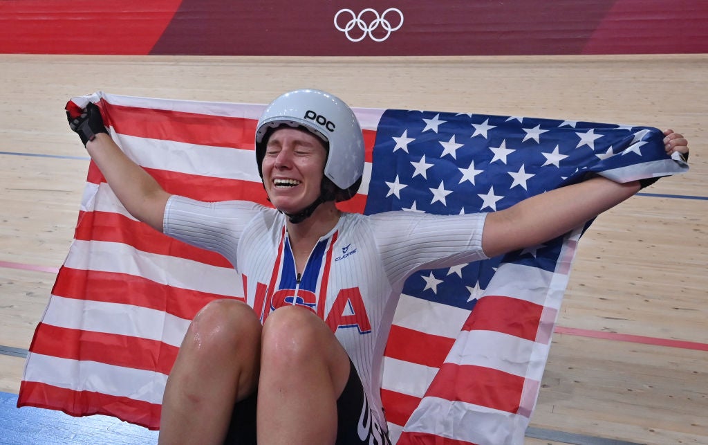 USA's Jennifer Valente poses with a flag after winning the women's track cycling omnium points race during the Tokyo 2020 Olympic Games at Izu Velodrome in Izu, Japan, on August 8, 2021. (Photo by Peter PARKS / AFP) (Photo by PETER PARKS/AFP via Getty Images)