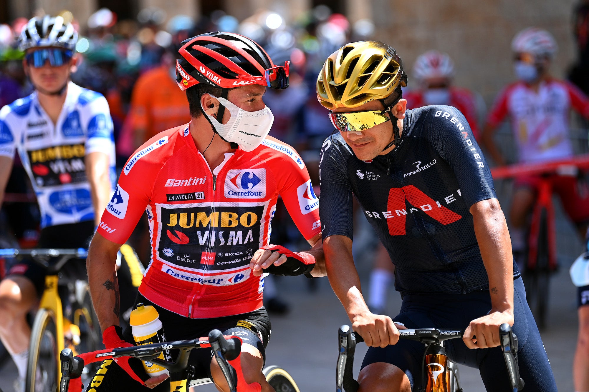 BURGOS, SPAIN - AUGUST 15: (L-R) Primoz Roglic of Slovenia and Team Jumbo - Visma red leader jersey and Richard Carapaz of Ecuador and Team INEOS Grenadiers winner of Olympic road race prepare for the race prior to the 76th Tour of Spain 2021, Stage 2 a 166,7km stage from Caleruega - Monasterio de Santo Domingo de Guzmán to Burgos - Gamonal / @lavuelta / #LaVuelta21 / #CapitalMundialdelCiclismo / on August 15, 2021 in Burgos, Spain. (Photo by Stuart Franklin/Getty Images)
