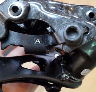 A Campagnolo Super Record front derailleur with an "A" designation.