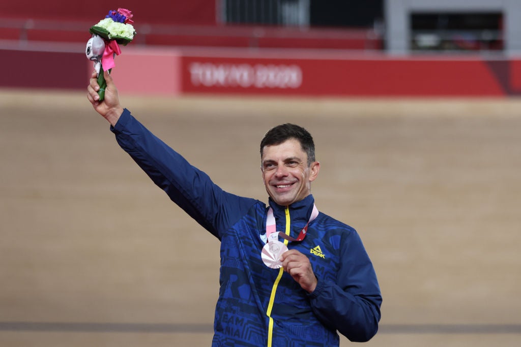 IZU, JAPAN - AUGUST 27: Silver medalist Carol-Eduard Novak of Team Romania celebrates on the podium during the medal ceremony for the Track Cycling Men's C4 4000m Individual Pursuit Final on day 3 of the Tokyo 2020 Paralympic Games at Izu Velodrome on August 27, 2021 in Izu, Shizuoka, Japan. (Photo by Kiyoshi Ota/Getty Images)