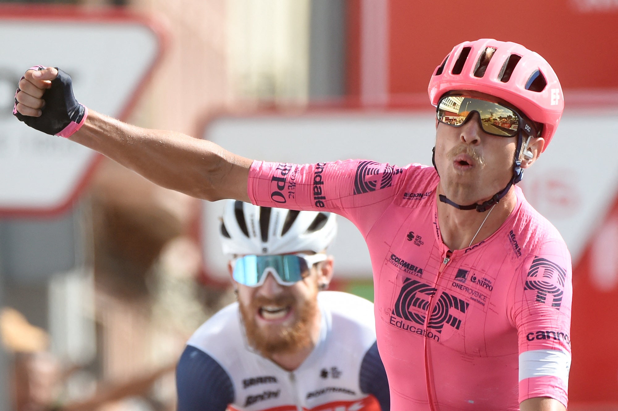 EF Education-Nippo's Danish rider Magnus Cort Nielsen celebrates his first place next to third placed Team Trek's US rider Quinn Simmons (L) during the 19th stage of the 2021 La Vuelta cycling tour of Spain, a 191.2 km race from Tapia to Monforte de Lemos, on September 3, 2021. (Photo by MIGUEL RIOPA / AFP) (Photo by MIGUEL RIOPA/AFP via Getty Images)