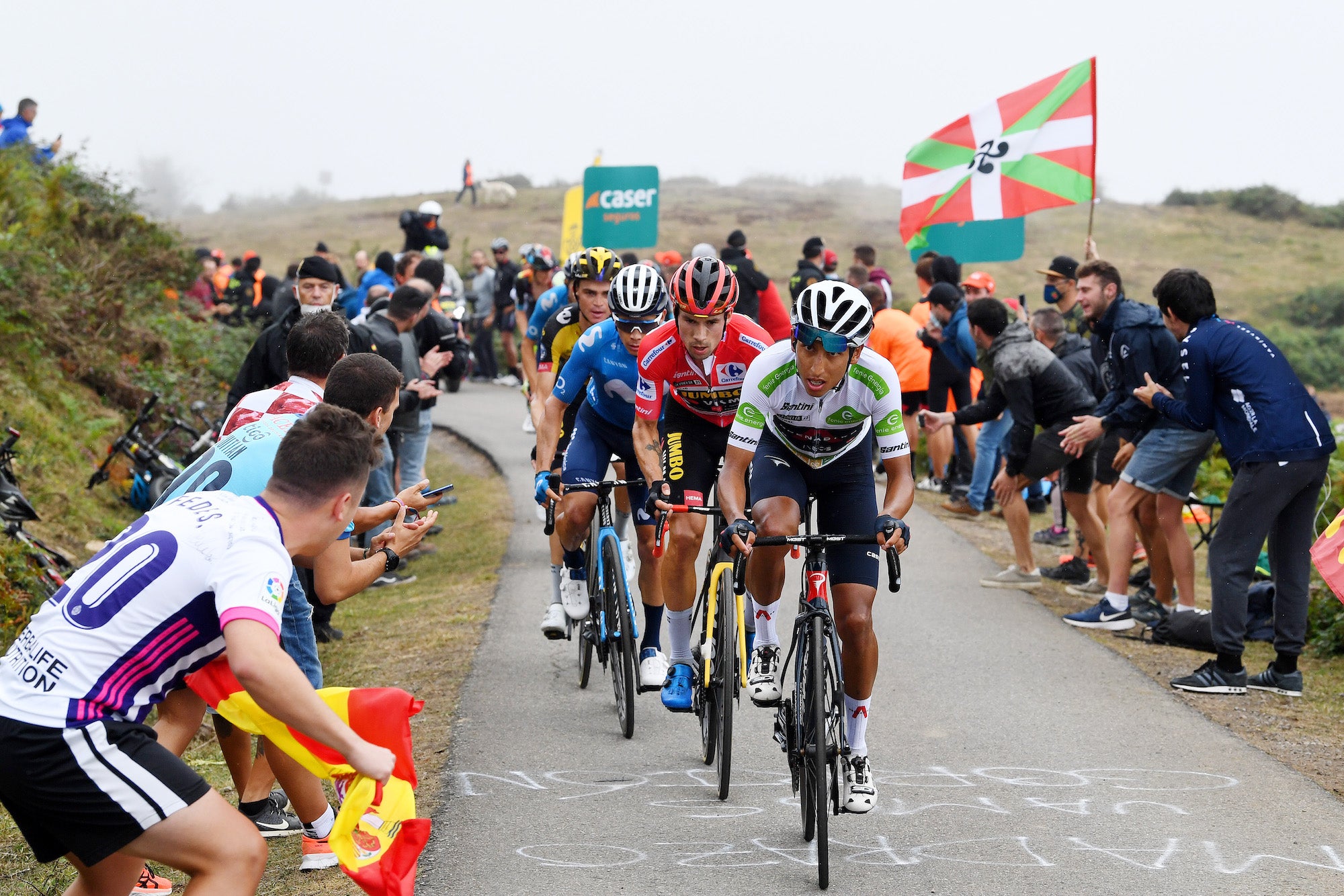 ALTU D’EL GAMONITEIRU, SPAIN - SEPTEMBER 02: Egan Arley Bernal Gomez of Colombia and Team INEOS Grenadiers competes in the breakaway ahead of Primoz Roglic of Slovenia and Team Jumbo - Visma red leader jersey and Miguel Ángel López Moreno of Colombia and Movistar Team while fans cheer during the 76th Tour of Spain 2021, Stage 18 a 162,6km stage from Salas to Altu d’El Gamoniteiru 1770m / @lavuelta / #LaVuelta21 / on September 02, 2021 in Altu d’El Gamoniteiru, Spain. (Photo by Tim de Waele/Getty Images)