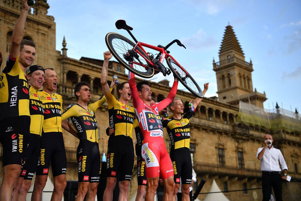 SANTIAGO DE COMPOSTELA, SPAIN - SEPTEMBER 05: A general view of Lennard Hofstede of Netherlands, Steven Kruijswijk of Netherlands, Robert Gesink of Netherlands, Sepp Kuss of United States, Primoz Roglic of Slovenia red leader jersey, Nathan Van Hooydonck of Belgium, Sam Oomen of Netherlands and Koen Bouwman of Netherlands and Team Jumbo - Visma celebrate winning on the podium ceremony while lifting his Cervelo bicycle in the Plaza del Obradoiro with the Cathedral in the background after the 76th Tour of Spain 2021, Stage 21 a 33,8 km Individual Time Trial stage from Padrón to Santiago de Compostela / @lavuelta / #LaVuelta21 / ITT / on September 05, 2021 in Santiago de Compostela, Spain. (Photo by Stuart Franklin/Getty Images)